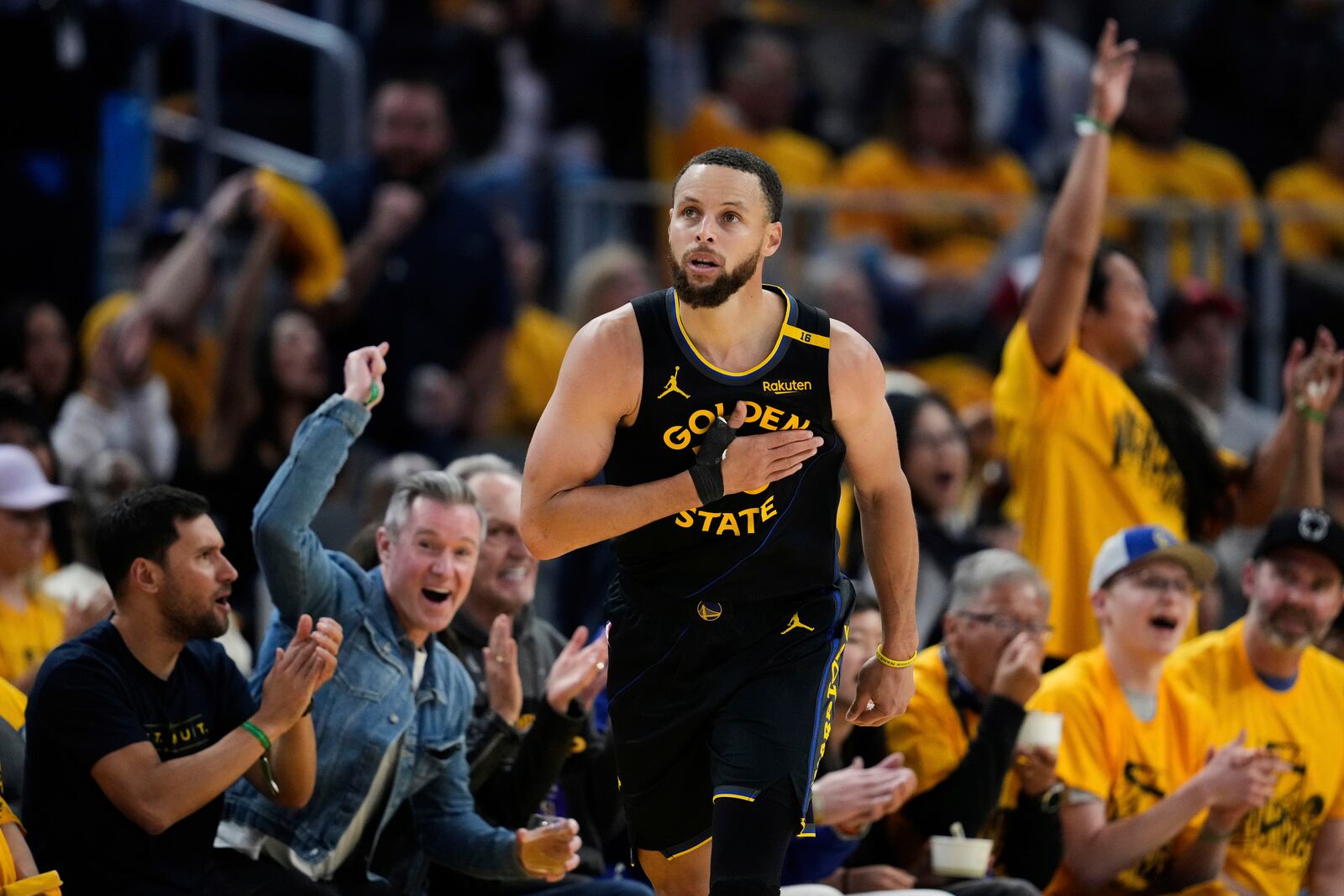 Golden State Warriors guard Stephen Curry reacts after making a 3-point basket during the second half of Game 6 of an NBA basketball first-round playoff series against the Houston Rockets, Friday, May 2, 2025, in San Francisco. (AP Photo/Godofredo A. Vásquez)