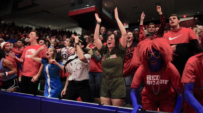 Fans in the Red Scare student section cheer during a game in the 2019-20 season at UD Arena.