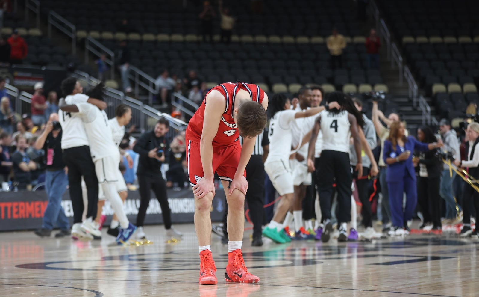 Dayton's Jordan Derkack reacts after a loss to Virginia Commonwealth in th eAtlantic 10 Conference championship game on Sunday, March 15, 2026, at PPG Paints Arena in Pittsburgh. David Jablonski/Staff