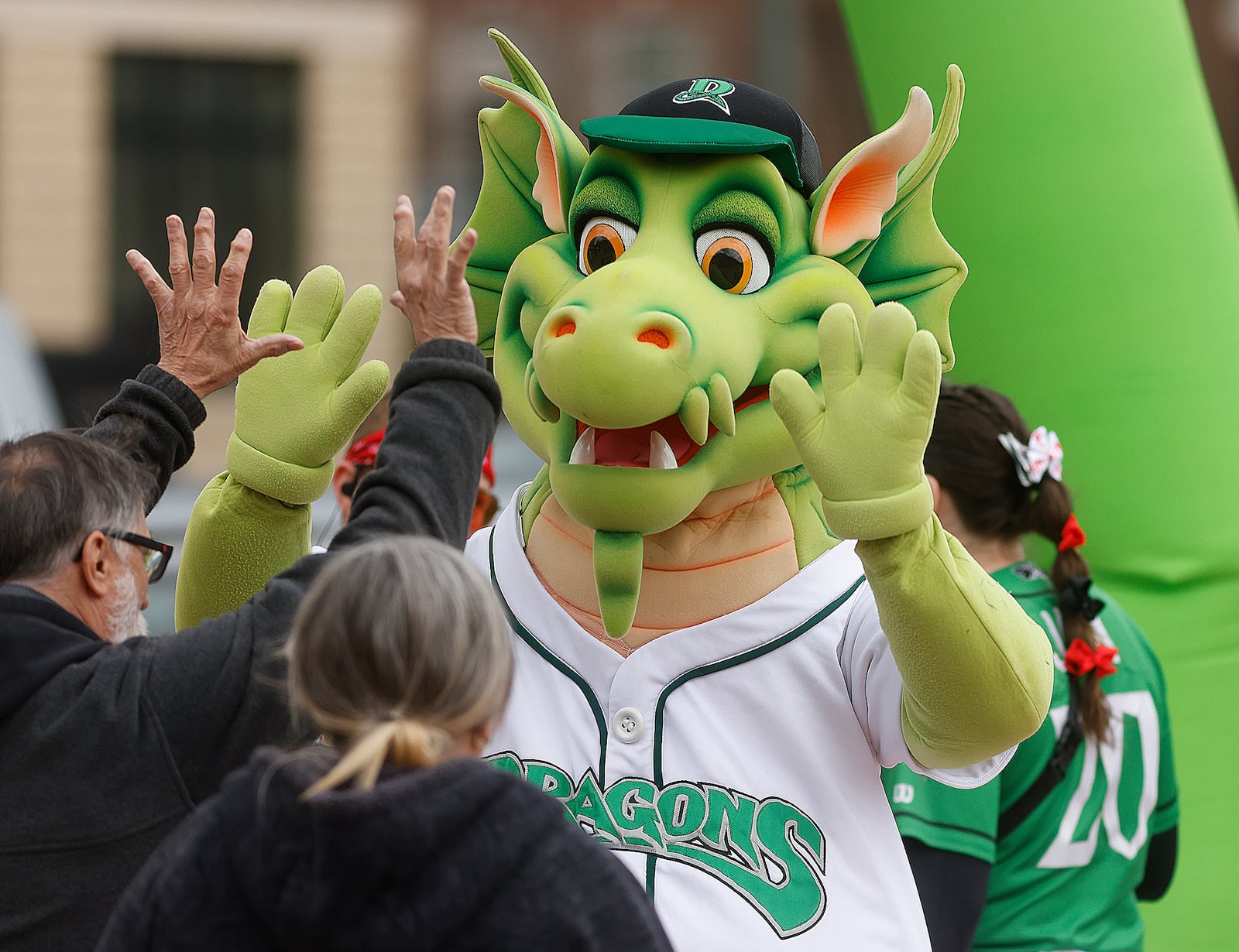 Heater, the Dayton Dragons mascot, entertains fans outside Day Air Ballpark Tuesday, March 25, 2025. STAFF