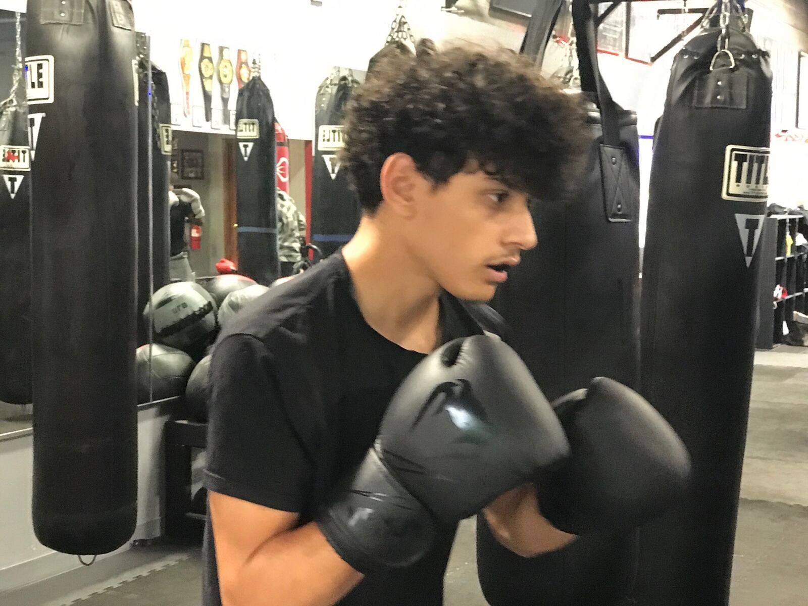 Kareem Moreab, a 17 year old bantamweight, during a training session Monday evening at the DMC Boxing Academy  in Centerville. Moreab, a sophomore at West Carrolton High School, was born in Palestine abnd moved to the United States before his first birthday. He’s 6-1 as an amateur boxer and scored an impressive win Sunday over Eric Scott of Cleveland in the Summer Power boxing show at DMC. Tom Archdeacon/CONTRIBUTED