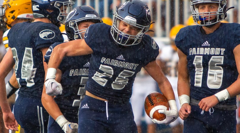 Fairmont's Stevie Doty celebrates a first-half interception during an Aug. 17 game at Roush Stadium. Fairmont won 24-21. Jeff Gilbert/CONTRIBUTED