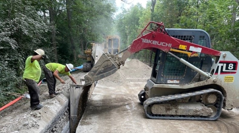 City of Union crews installed new water lines on Martindale Road in Vandalia last year. The $3 million project will allow Aullwood Audubon Farm Discovery Center to get access to public water after 'forever chemicals' were detected in the facility's drinking water well in 2020./ISMAIL TURAY TURAY JR./STAFF