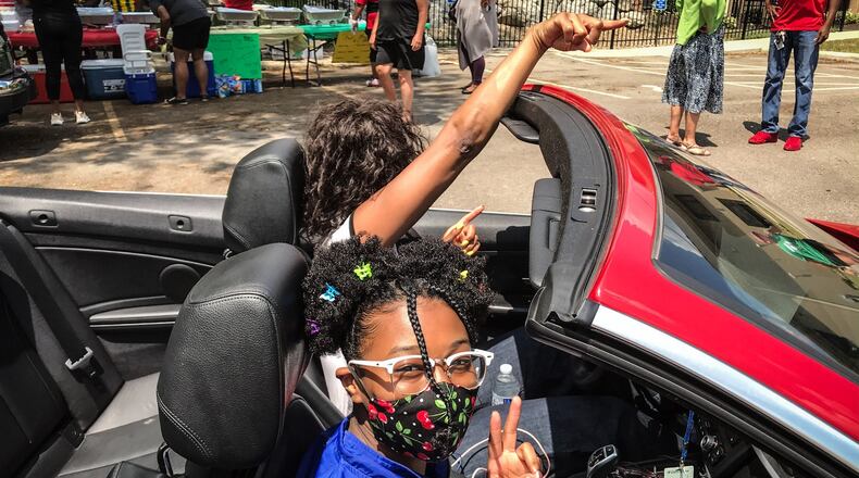 DECA Prep held a drive-thru Juneteenth celebration at the school on Homewood Ave. in Dayton June 19, 2020. Deaunna Watson organized the event and said family and community were invited to the COVID-19 aware event. JIM NOELKER/STAFF