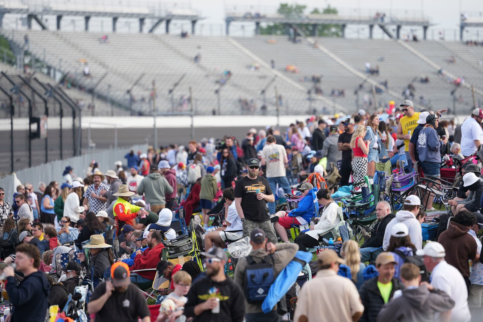 Fans congregate before the start of the Indianapolis 500 auto race at Indianapolis Motor Speedway in Indianapolis, Sunday, May 25, 2025. (AP Photo/AJ Mast)