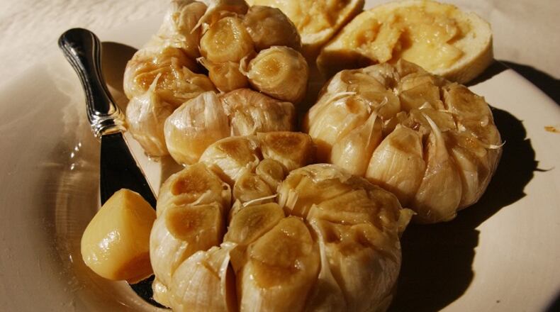Roasting garlic mellows its flavor and softens its texture. (Rodney Curtis/Detroit Free Press/TNS)