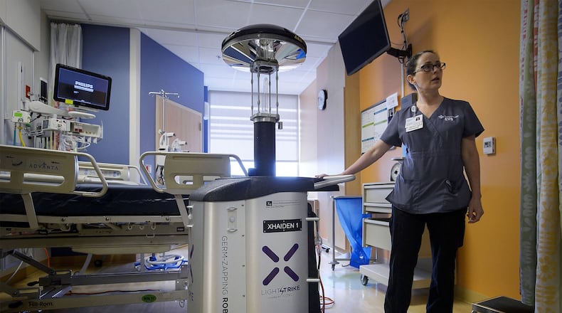 Environmental Services UV Technichian Patricia Mullins deploys a “Xenex Germ-Zapping robot” to disinfect a hospital room at Sutter Medical Center in Sacramento on Tuesday, March 7, 2017. Xenex is a company that manufactures robots which use what they call a “LightStrike” system using xenon ultraviolet light pulses to kill germs on all surfaces within a seven-foot radius. Sutter Medical Center is the first hospital in the are to use the robots. (Randall Benton/The Sacramento Bee/TNS)