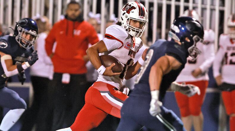 Wayne's Tyrell Lewis races Fairmont's Toby Deglow to the end zone for a Warriors' touchdown during round two of the playoffs Friday, Nov. 8, 2024. BILL LACKEY/STAFF
