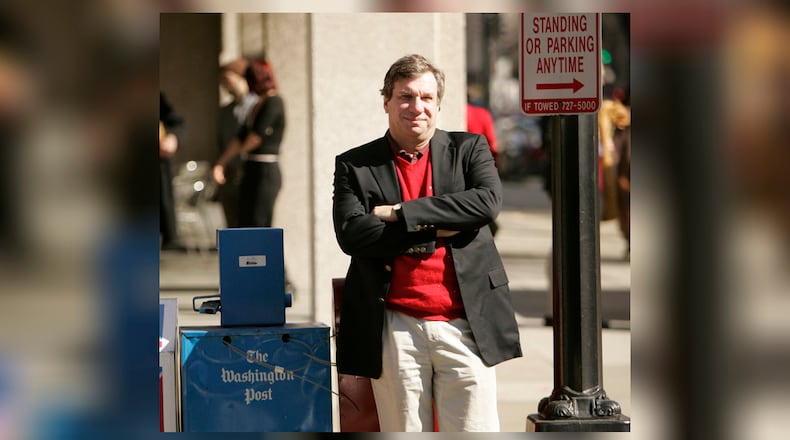 FILE - Sports writer and author John Feinstein poses in Washington, Feb. 28, 2006. (AP Photo Caleb Jones, file)