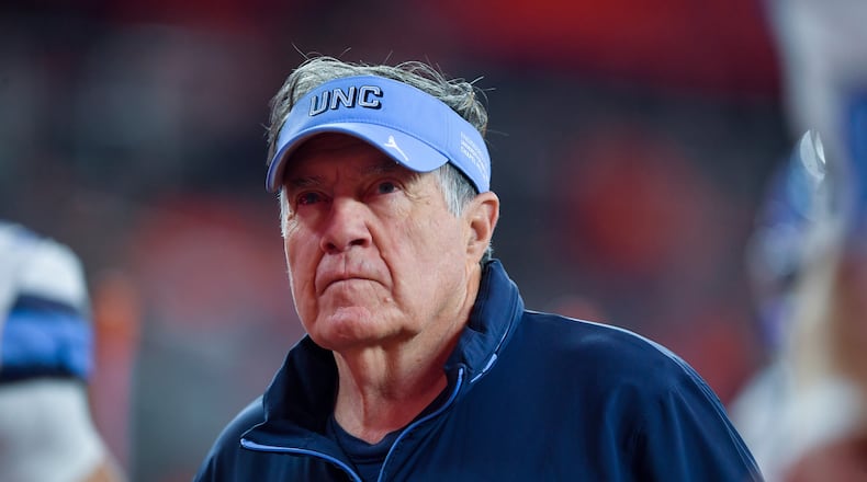 FILE - North Carolina head coach Bill Belichick walks on the field before an NCAA college football game against Syracuse, Oct. 31, 2025, in Syracuse, N.Y. (AP Photo/Adrian Kraus, File)