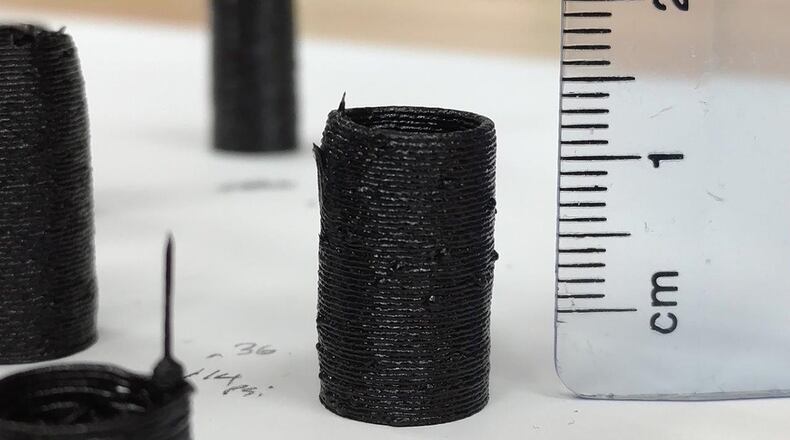 The additive manufacturing process involves depositing thin layers of composite materials on top of each other. Air Force Research Laboratory Composite Materials and Processing team researchers used the ultra-bright X-ray at the National Synchrotron Light Source II at Brookhaven National Laboratory to gain better insight into the bonding of composite layers during the additive manufacturing process. (U.S. Air Force photo/Harry Pierson)