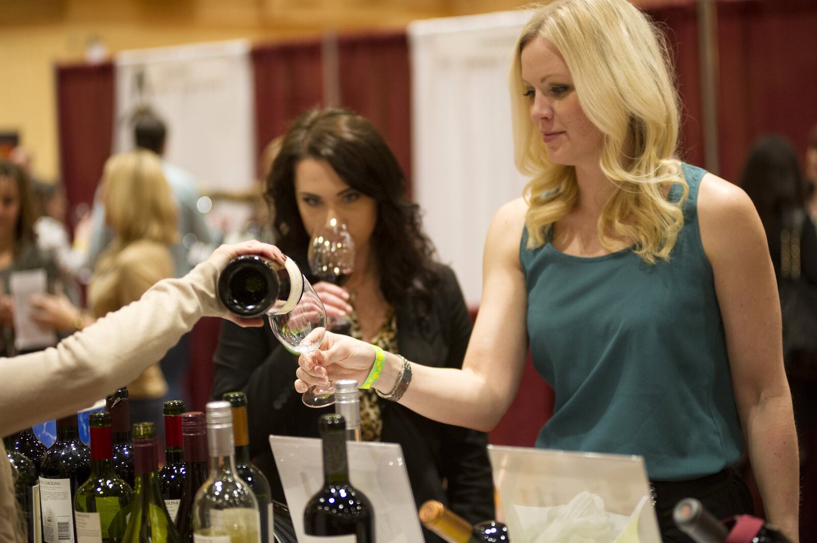 Connoisseurs investigate and sample the hundreds of varieties of wine at the 2014 Cincinnati International Wine Festival. CONTRIBUTED