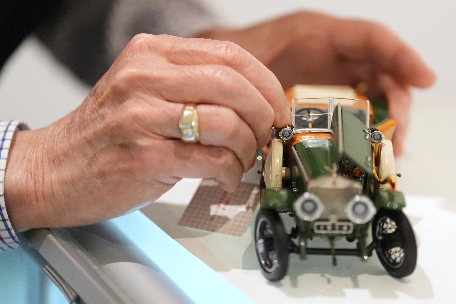 Mike Caltrider repairs a model part of the automobilia collection at The Rolls-Royce Foundation in Mechanicsburg, Pa., Saturday, April 5, 2025. (AP Photo/Matt Rourke)