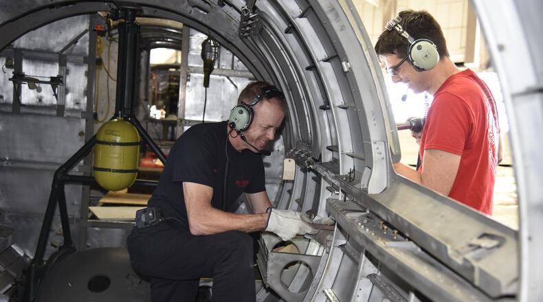 DAYTON, Ohio (06/2017) — (From left to right) Restoration Specialists Brian Lindamood and Casey Simmons work on the fuselage of the B-17F “Memphis Belle” in the restoration hangar at the National Museum of the U.S. Air Force. The exhibit opening for this aircraft is planned for May 17, 2018.(U.S. Air Force photo by Ken LaRock)