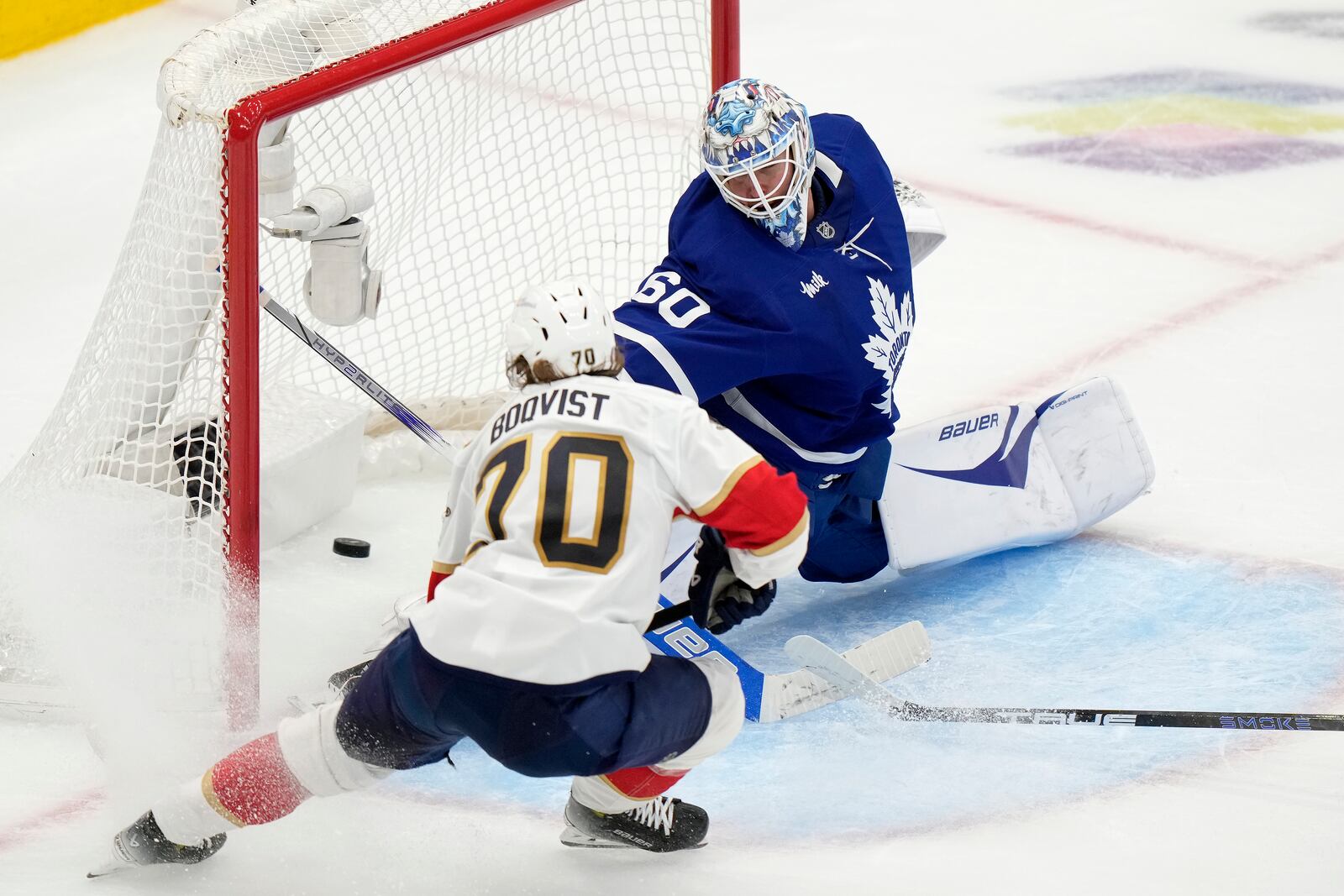 Florida Panthers' Jesper Boqvist (70) scores on Toronto Maple Leafs goaltender Joseph Woll (60) during second period NHL playoff hockey action in Toronto on Wednesday, May 14, 2025. (Frank Gunn/The Canadian Press via AP)