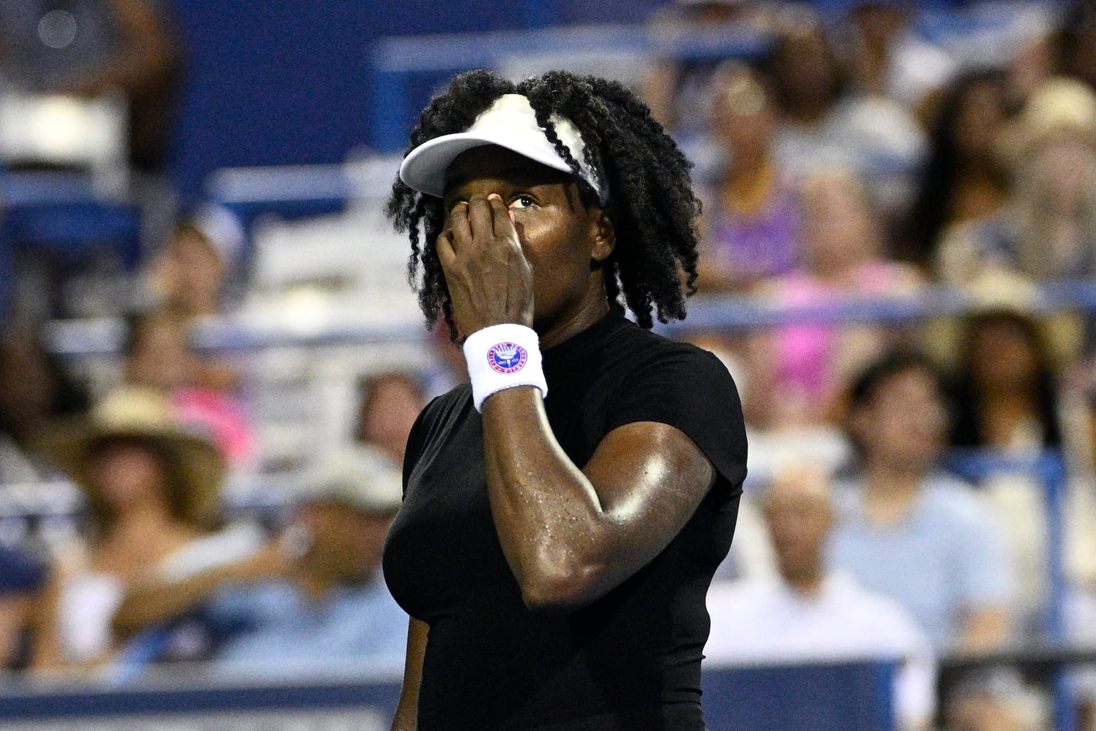 Venus Williams reacts during a match against Magdalena Frech, of Poland, at the Citi Open tennis tournament Thursday, July 24, 2025, in Washington. (AP Photo/Nick Wass)