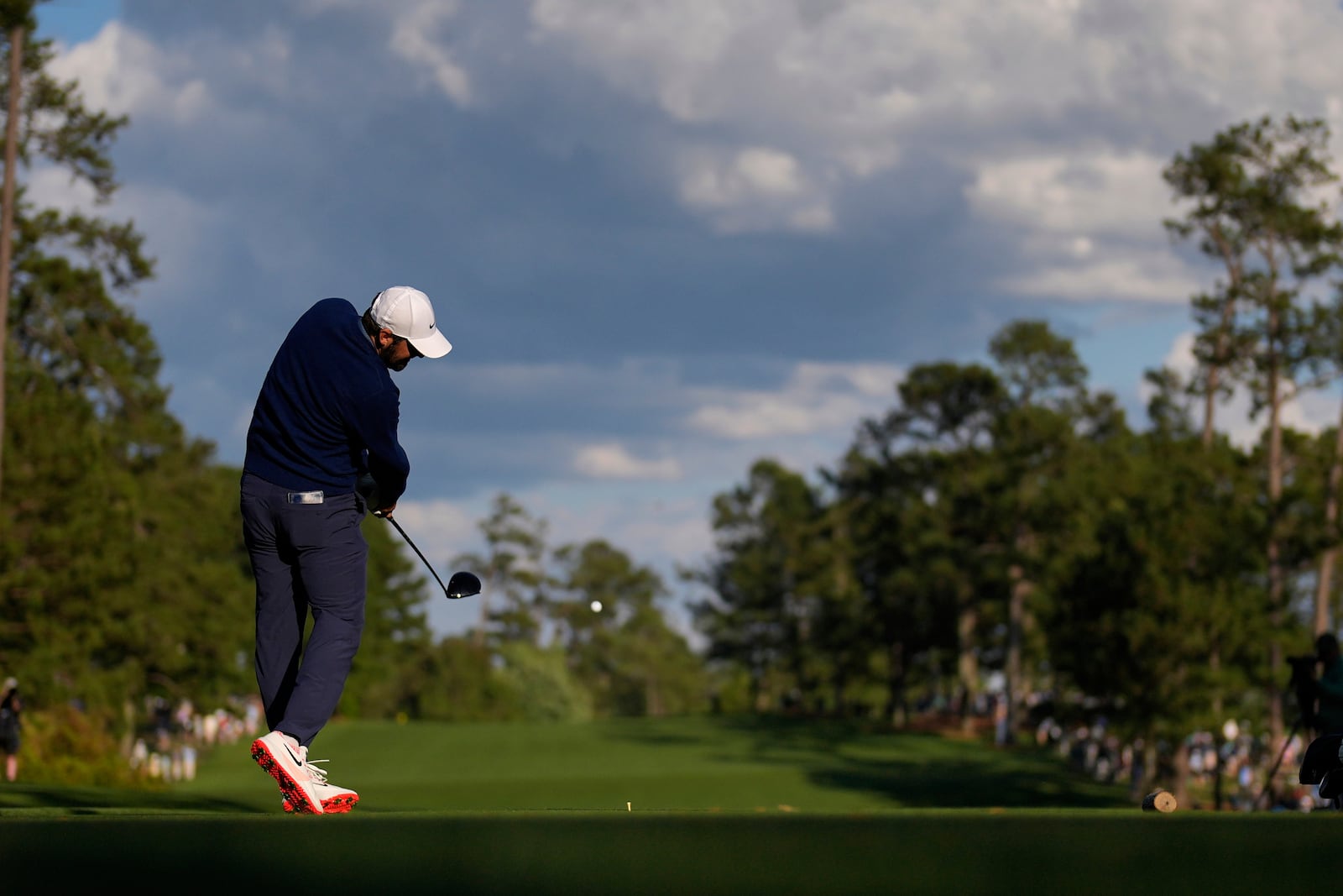 Scottie Scheffler hits his tee shot on the 14th hole during the second round at the Masters golf tournament, Friday, April 11, 2025, in Augusta, Ga. (AP Photo/David J. Phillip)