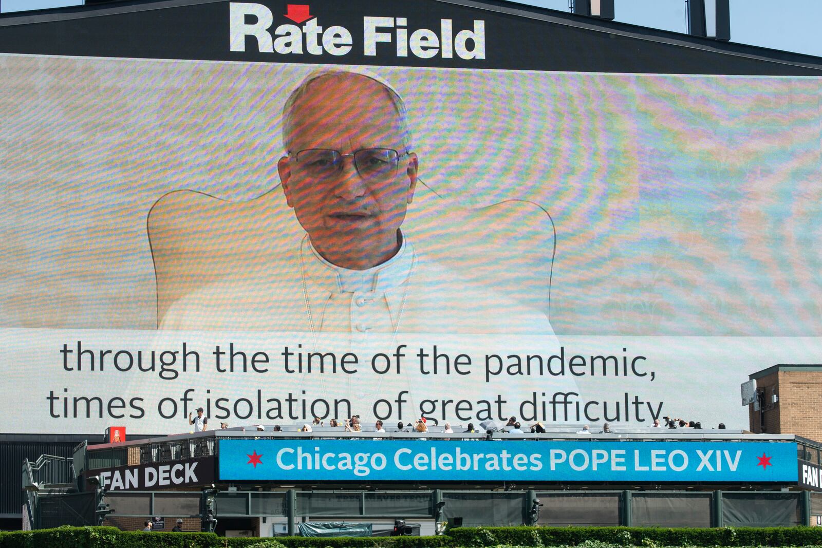 Pope Leo XIV delivers a message to the crowd via video during the Archdiocese of Chicago's celebration of Pope Leo XIV at Rate Field, Saturday, June 14, 2025. (Pat Nabong/Chicago Sun-Times via AP)
