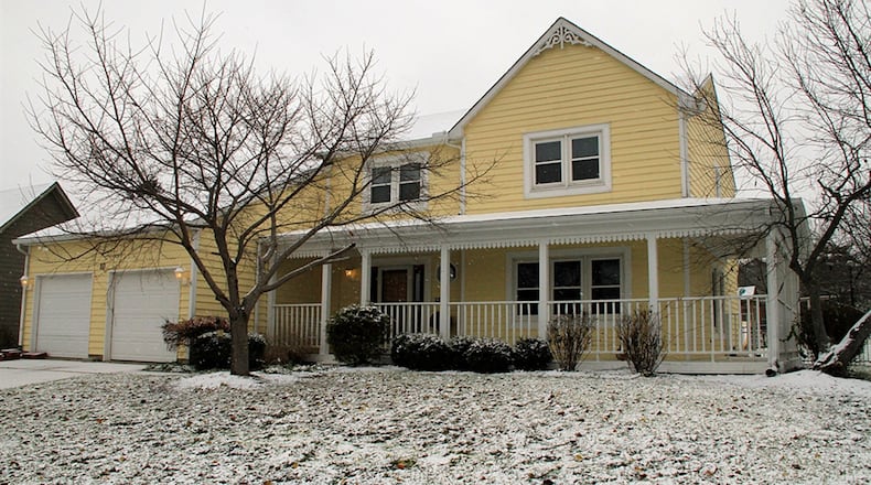 A front porch wraps around to the side year where a wrought-iron fence surrounds the back yard that includes an oversized concrete patio. A finished basement adds to the potential living space. CONTRIBUTED PHOTOS BY KATHY TYLER