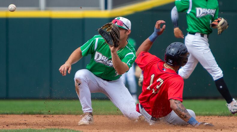 Dayton second baseman Tyler Callihan fields a throw as Cedar Rapids' Emmanuel Rodriguez steals second base in the first inning Sunday at Day Air Ballpark. The start of the game was delayed by nearly three hours because of inclement weather. Jeff Gilbert/CONTRIBUTED