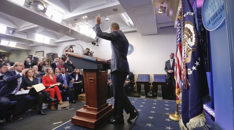 President Barack Obama waves at the conclusion of his final presidential news conference onWednesday in the briefing room of the White House.
