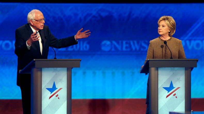 Bernie Sanders, left, offers an apology to Hillary Clinton during a Democratic presidential primary debate Saturday, Dec. 19, 2015, at Saint Anselm College in Manchester, N.H. (AP Photo/Jim Cole)