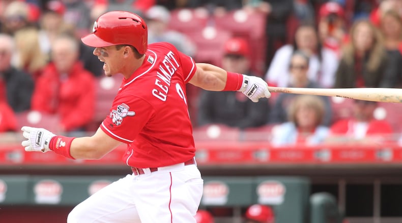 The Redsâ Scooter Gennett swings against the Nationals on Saturday, March 31, 2018, at Great American Ball Park in Cincinnati. David Jablonski/Staff