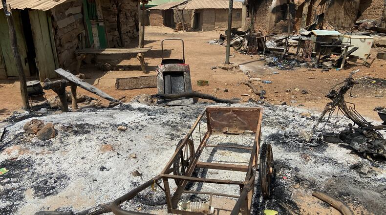 Charred homes and tools are in ruins days after an attack in the village of Woro, Nigeria, Thursday, Feb. 5, 2026. (AP Photo/Musa Salim)
