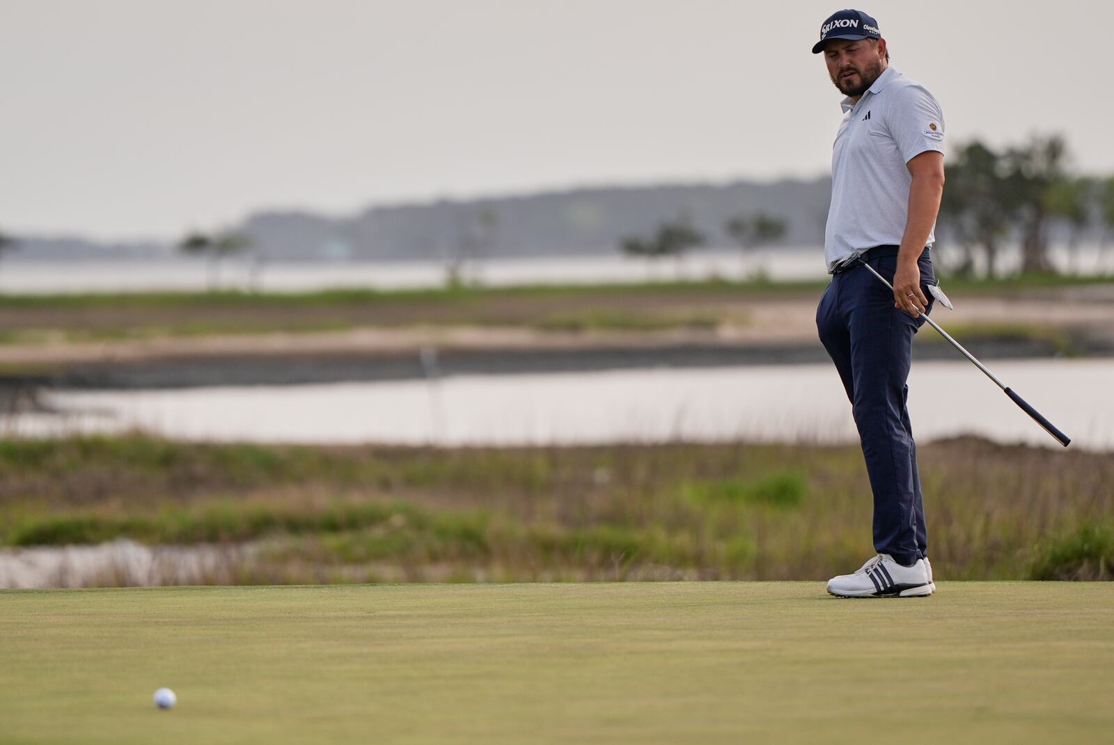 Andrew Novak watches his putt on the 18th hole during a playoff in the final round of the RBC Heritage golf tournament, Sunday, April 20, 2025, in Hilton Head Island, S.C. (AP Photo/Mike Stewart)