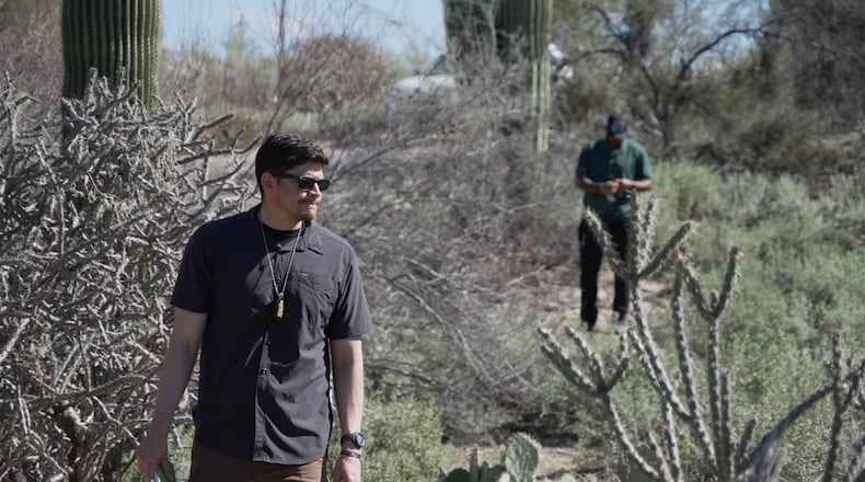 Law enforcement agents check vegetation areas around Nancy Guthrie’s home in Tucson, Ariz., Wednesday, Feb. 11, 2026. (AP Photo/Ty ONeil)