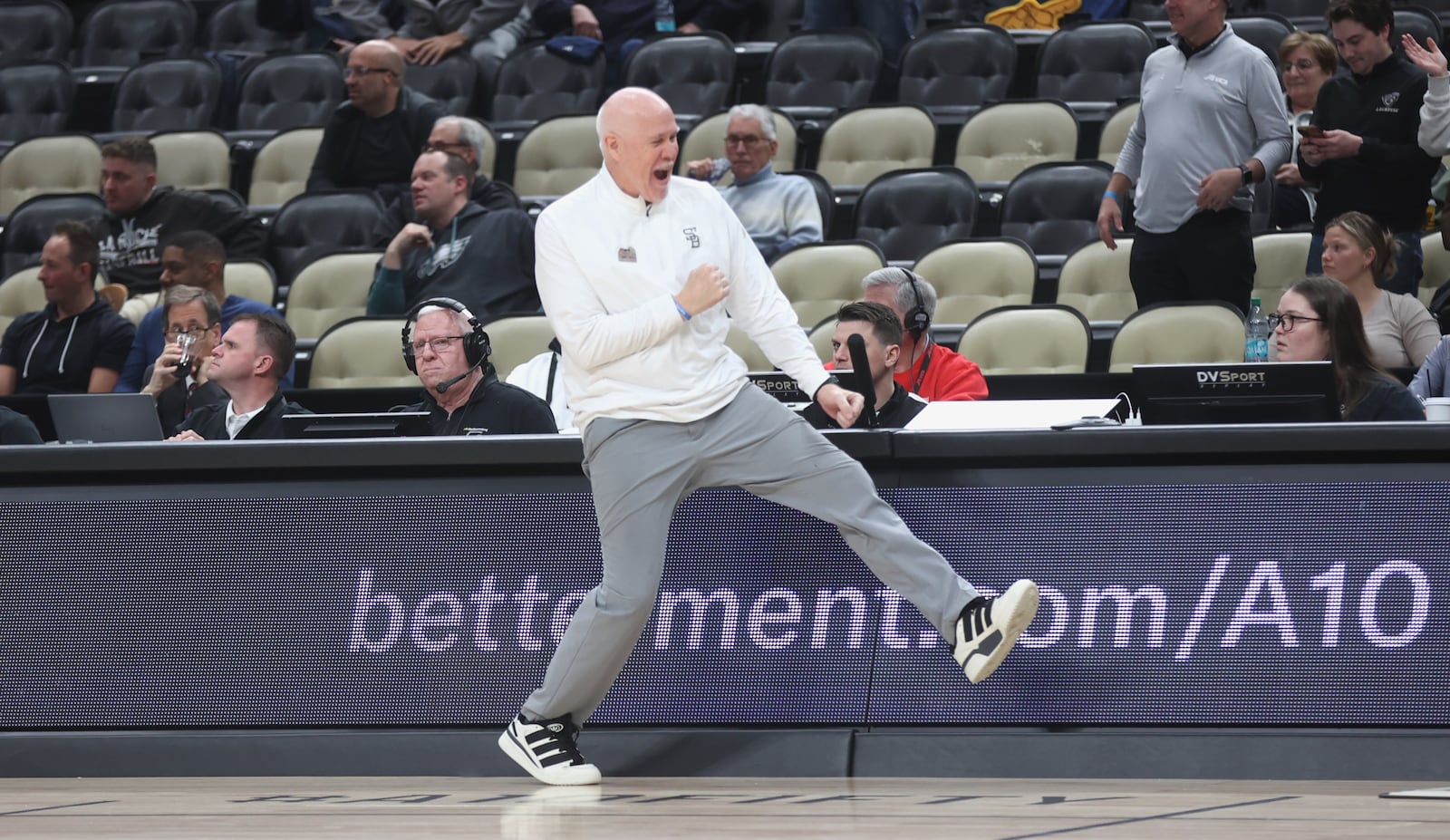 St. Bonaventure's Mark Schmidt celebrates a victory against George Mason in the second round of the Atlantic 10 Conference tournament on Thursday, March 12, 2026, at PPG Paints Arena in Pittsburgh. David Jablonski/Staff