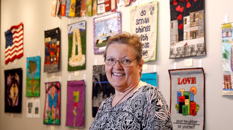 Cathy Jeffers organized a"Dayton Strong, A Quilt Show" on display at the Woodbourne Library in Centerville through Dec. 2. The exhibition is the Creative Quilters Guild's response to the May Ku Klux Klan rally in Dayton, the Memorial Day tornadoes and the Oregon District shootings. LISA POWELL / STAFF