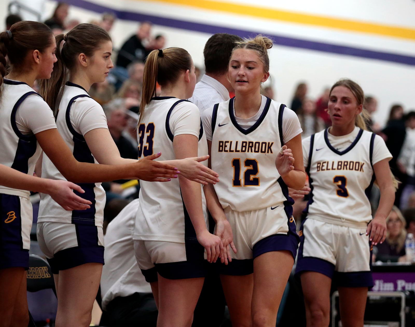 Bellbrook junior Lauren Fabrick and sophomore Libby Bunsold are congratulated by teammates as they come off the court as they beat Waynesville 61-30 in a Southwestern Buckeye League crossover game on Thursday, Feb. 12, 2026. STEVEN WRIGHT / STAFF