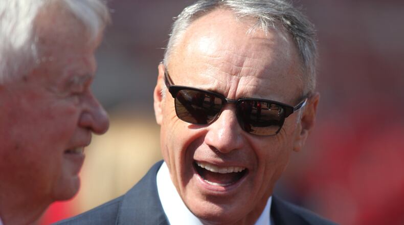 MLB Commissioner Rob Manfred (right) with Reds owner Bob Castellini prior to Thursday’s Opening Day game at Great American Ball Park. David Jablonski/STAFF