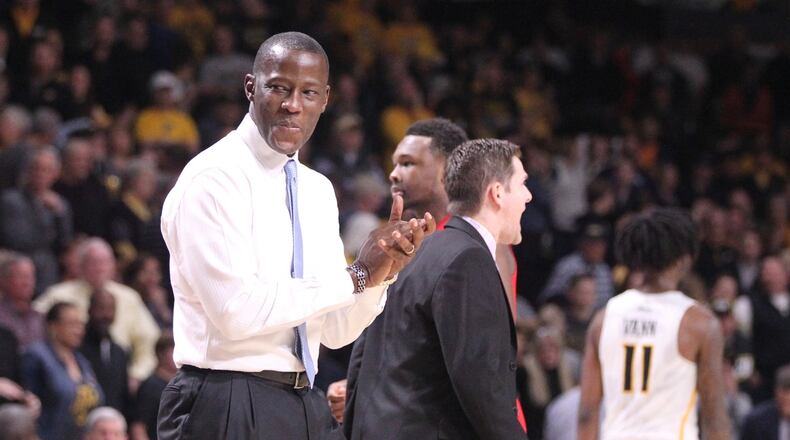 Dayton’s Anthony Grant reacts after a basket bay Josh Cunningham forced overtime against Virginia Commonwealth on Saturday, Feb. 10, 2018, at the Siegel Center in Richmond, Va. David Jablonski/Staff