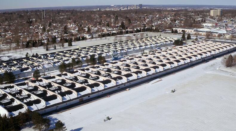 Kettering announced the project it has been working on landing for its business park is an Amazon last-mile distribution center that would bring hundreds of jobs. Plans would involve demolishing the building in the foreground along Wilmington Pike to make way for the new distribution center. TY GREENLEES / STAFF