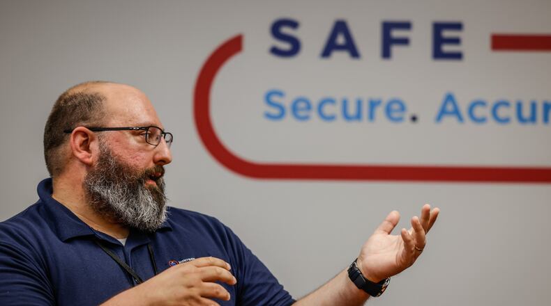 Montgomery County Board of Elections Infrastructure Engineer Adam Lawson explains how many safeguards there are in place to secure elections in Montgomery County in this Wednesday, July 6, 2022, photo. JIM NOELKER/STAFF