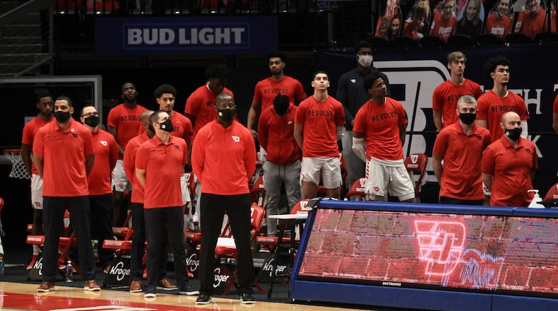 Dayton stands for the national anthem before a game against Saint Louis on Friday, Feb. 19, 2021, at UD Arena. David Jablonski/Staff