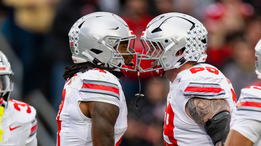 Ohio State wide receiver Jeremiah Smith (4) celebrates a touchdown with offensive lineman Ian Moore (69) during the first half of an NCAA college football game against Purdue, Saturday, Nov. 8, 2025, in West Lafayette, Ind. (AP Photo/Doug McSchooler)