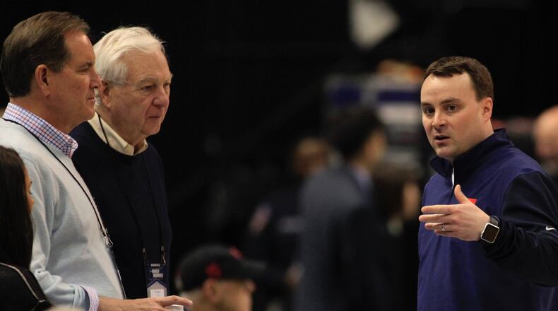 Dayton’s Archie Miller, right, talks to Jim Nantz and Bill Raftery, of CBS, during a NCAA tournament practice on Thursday, March 16, 2017, at Bankers Life Fieldhouse in Indianapolis. David Jablonski/Staff