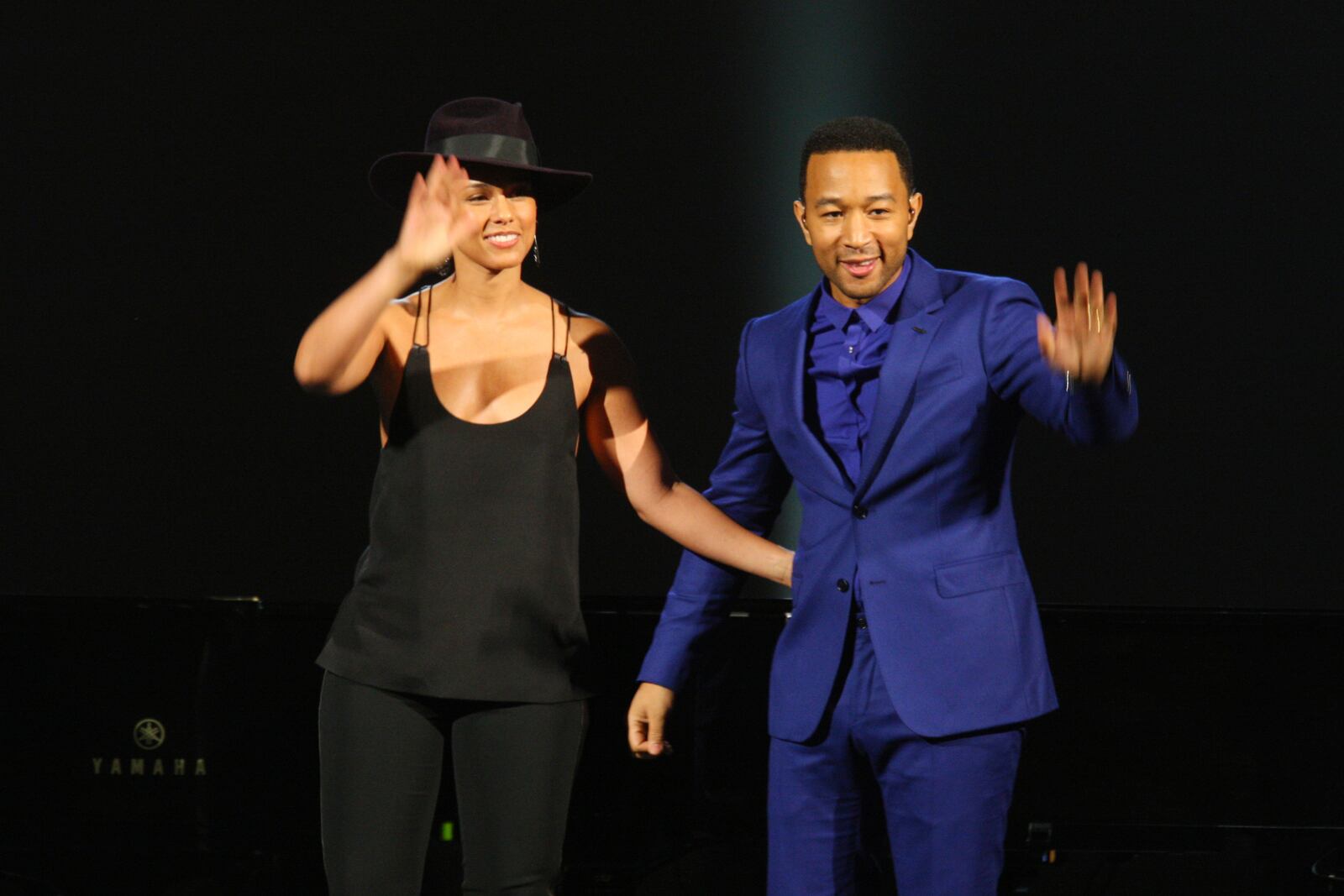 FILE - In this Jan. 27, 2014 file photo, Alicia Keys, left, and John Legend wave after their performance at The Night That Changed America: A Grammy Salute to the Beatles in Los Angeles.  Legend latest release "Bigger Love" comes out Friday, June 19. (Photo by Zach Cordner/Invision/AP, File)