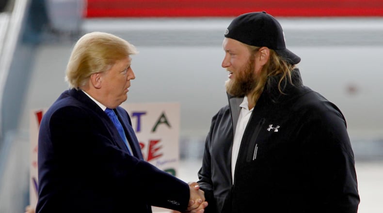 Former Ohio State Buckeye football player Nick Mangold appeared with then-candidate/now President Donald Trump at a rally at Wright Brothers Aero in Vandalia in March 2016. LISA POWELL / STAFF