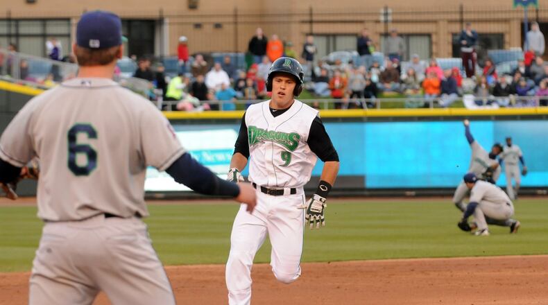 The Dragons' Ryan Wright hustles to third base in the third inning and beats the throw. Wright went 3-for-3 with an RBI and a run scored in a 3-2 win Tuesday at Fifth Third Field. Contributed photo by NICK FALZERANO