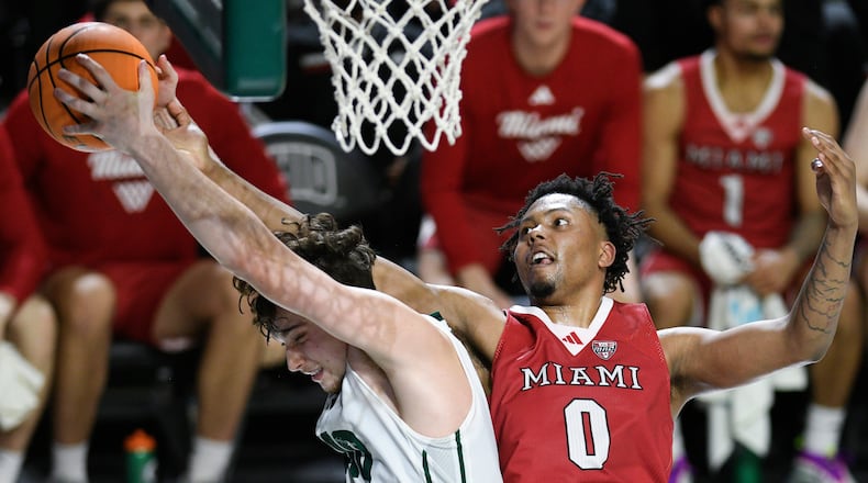 Ohio forward Aidan Hadaway (10) and Miami (Ohio) wing Eian Elmer (0) compete for a rebound during the second half of an NCAA college basketball game, Friday, March 6, 2026, in Athens, Ohio. (AP Photo/HG Biggs)