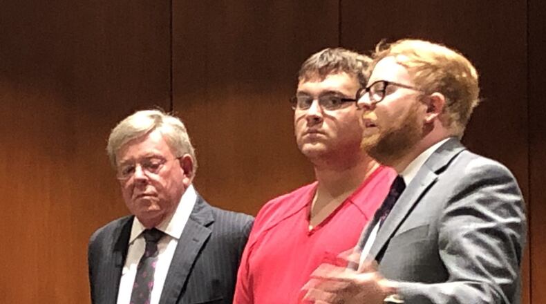 John Austin Hopkins listens as lawyer David Chicarelli argues for reasonable bail. STAFF/LAWRENCE BUDD