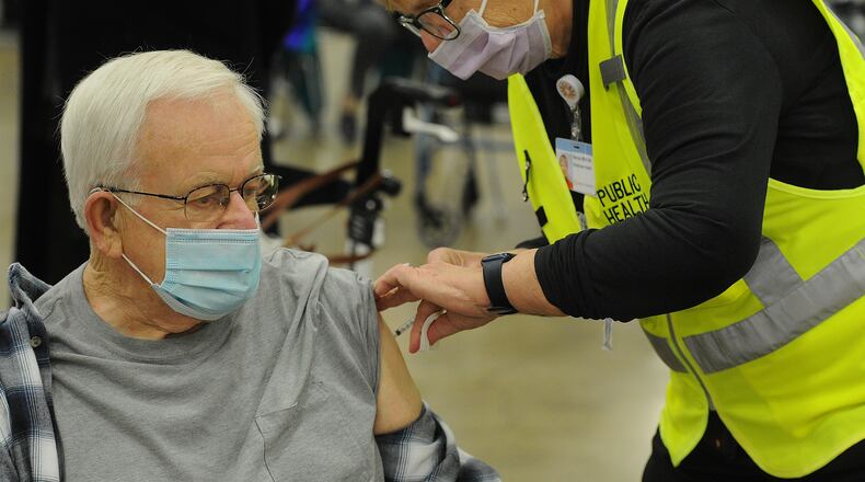 Medicare covers COVID-19 related costs such as vaccines, testing and hospitalizations. MARSHALL GORBY\STAFF