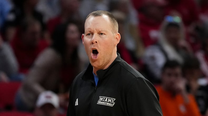 Miami (Ohio) head coach Travis Steele reacts during the second half of an NCAA college basketball game against Bowling Green, Friday, Feb. 20, 2026, in Oxford, Ohio. (AP Photo/Jeff Dean)