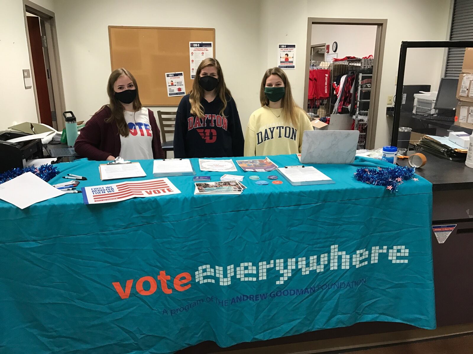 UDayton Votes table set up on campus Friday. Left to right are students Erin DeCero, Abby Medler and Hannah Hoby. Tom Archdeacon/STAFF