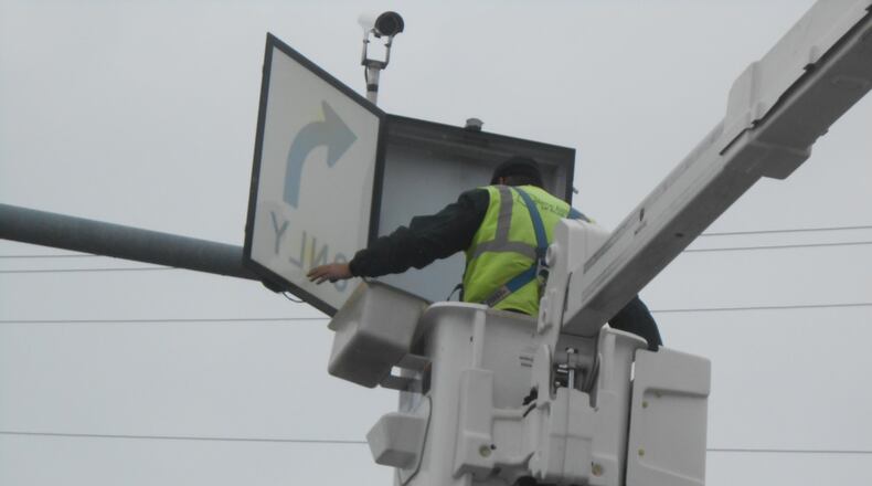 The city of Fairfield is about half way complete with its city-wide traffic signal upgrades, which includes doing something at nearly all of its 61 signaled intersections. That includes upgrading push buttons, adding back plates or new LEDs for street signs. Pictured is a contractor working on a signal at Ohio 4.