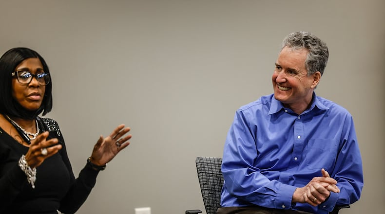 Substance use counselor, Keishan Dorsey, left, and associate professor of family medicine at Wright State University's Boonshoft School of Medicine, Dr. Peter Reynolds, along with other residents talk at Five Rivers Family Health Center on Monday, Feb. 13, 2023. Wright State's Boonshoft School of Medicine received a $2.3 million grant for mental health training for residents in their family medicine program. JIM NOELKER/STAFF